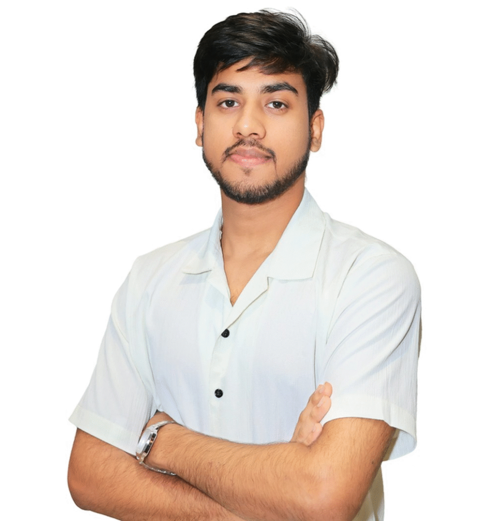 Krishna Gupta is a confident young man standing with folded arms, representing an instructor or student of web development courses.